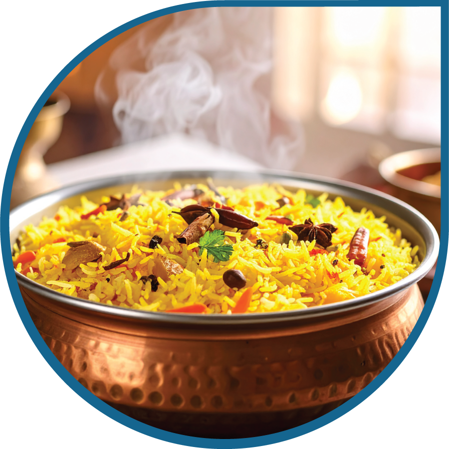Authentic biryani dish being prepared with Olexo vegetable ghee for a rich flavor.